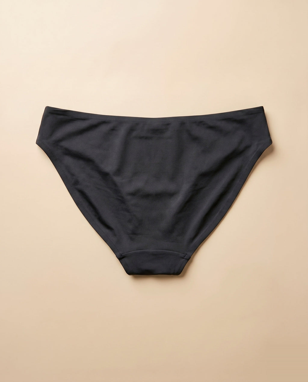 Bikini menstrual Apparelle negro visto desde atrás, packshot back anchor — tejido sin costuras