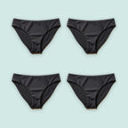 Pack de cuatro bikinis menstruales Apparelle en negro sobre fondo verde agua