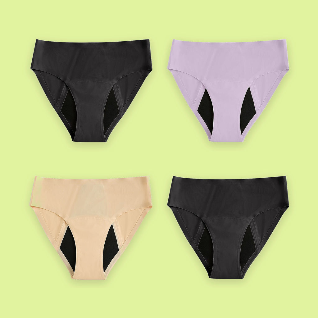 Pack de cuatro braguitas menstruales Apparelle Signature en negro, lavanda y beige sobre fondo lima